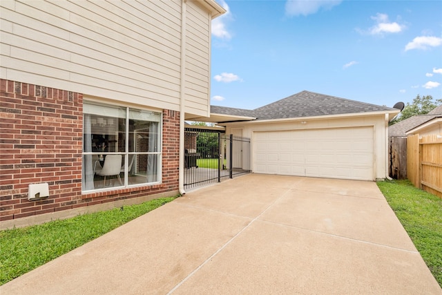 1706 Brightlake Way, Missouri City, TX 77459 - view of home's exterior with brick siding, concrete driveway, an attached garage, and a shingled roof