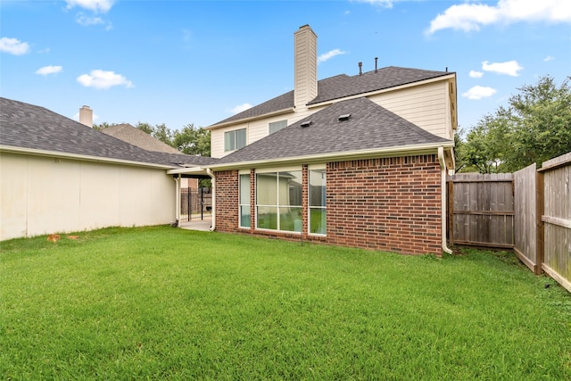 1706 Brightlake Way, Missouri City, TX 77459 - rear view of property featuring brick siding, a chimney, and a shingled roof