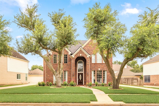 1706 Brightlake Way, Missouri City, TX 77459 - view of front facade with brick siding and a garage