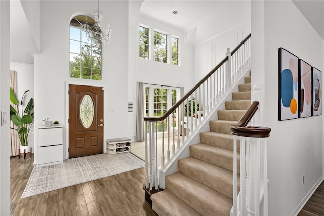1706 Brightlake Way, Missouri City, TX 77459 - foyer entrance with a high ceiling, a chandelier, dark wood-type flooring, and stairway
