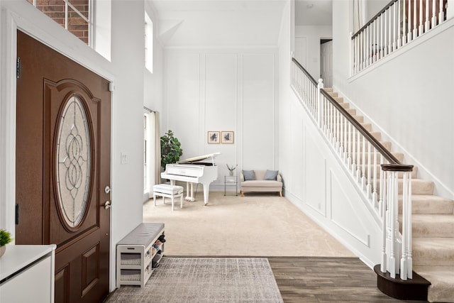1706 Brightlake Way, Missouri City, TX 77459 - entrance foyer with a high ceiling, stairway, and dark wood finished floors