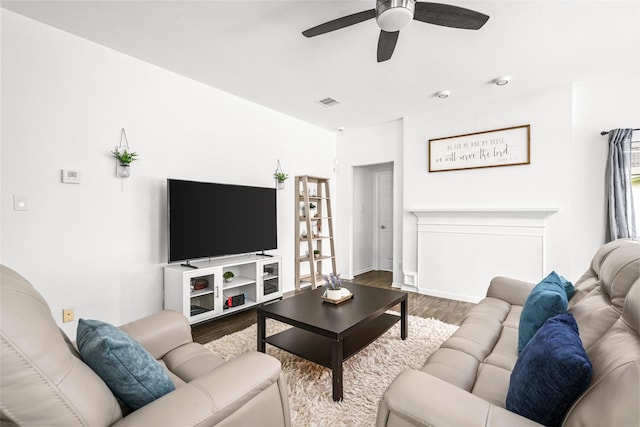 1706 Brightlake Way, Missouri City, TX 77459 - living area featuring wood finished floors, ceiling fan, and baseboards