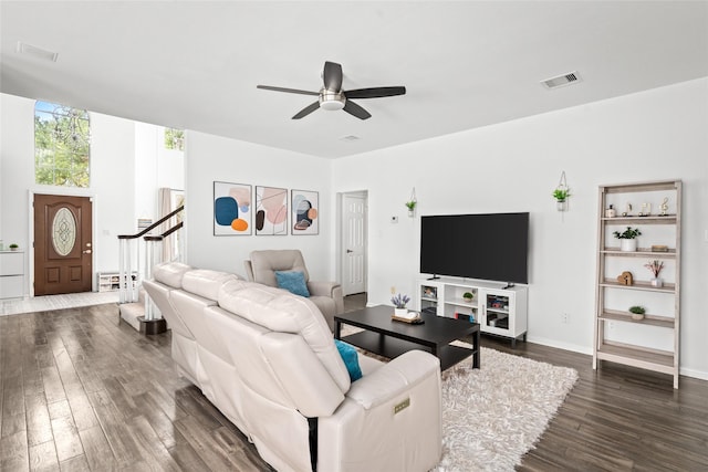 1706 Brightlake Way, Missouri City, TX 77459 - living area with stairway, dark wood-style floors, and a ceiling fan