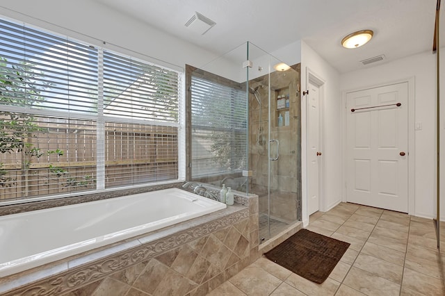 15427 Stonehill Dr, Houston, TX 77062 - full bath featuring a bath, tile patterned floors, and a shower stall