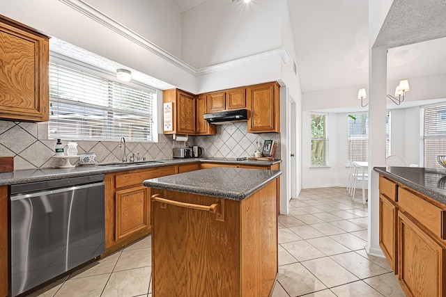 15427 Stonehill Dr, Houston, TX 77062 - kitchen featuring stainless steel dishwasher, a sink, under cabinet range hood, brown cabinetry, and a kitchen island