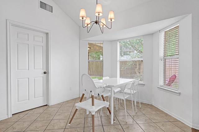 15427 Stonehill Dr, Houston, TX 77062 - dining room with a chandelier, vaulted ceiling, and baseboards
