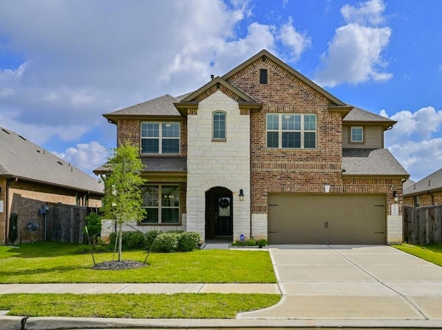 5422 Wildbrush Dr, Richmond, TX 77407 - view of front facade featuring brick siding, an attached garage, driveway, and stone siding