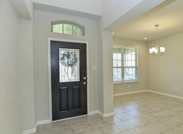 5422 Wildbrush Dr, Richmond, TX 77407 - entrance foyer with a chandelier, light tile patterned floors, baseboards, and recessed lighting