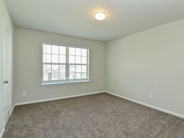 5422 Wildbrush Dr, Richmond, TX 77407 - empty room featuring carpet and baseboards