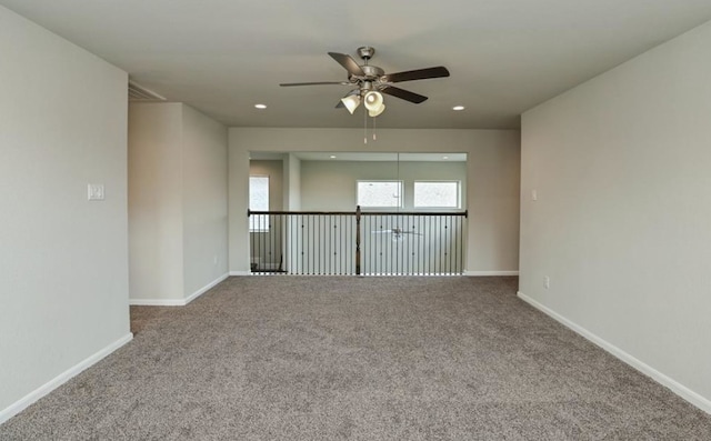 5422 Wildbrush Dr, Richmond, TX 77407 - spare room with a ceiling fan, carpet floors, baseboards, and recessed lighting