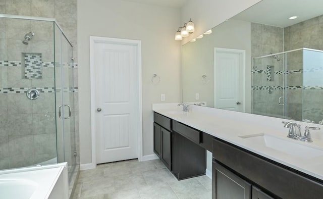 5422 Wildbrush Dr, Richmond, TX 77407 - bathroom with a shower stall, double vanity, a garden tub, and baseboards