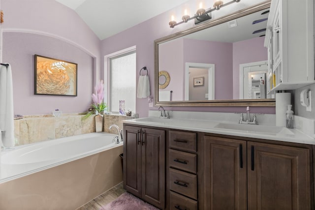 371 Westlake Terrace Dr, Conroe, TX 77304 - bathroom featuring double vanity, a bath, and lofted ceiling
