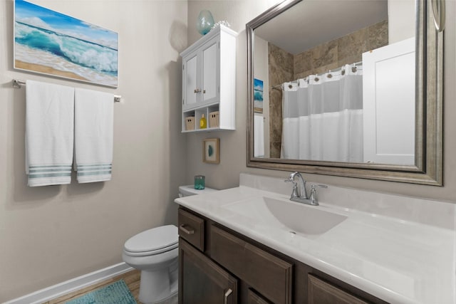 371 Westlake Terrace Dr, Conroe, TX 77304 - full bath with vanity, toilet, baseboards, curtained shower, and wood finished floors