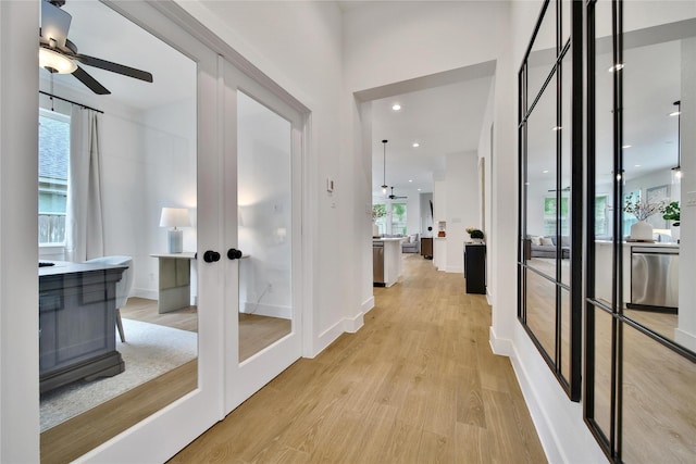 296 N Cascade Heights Dr, Montgomery, TX 77316 - hall featuring french doors, light wood-type flooring, plenty of natural light, and baseboards