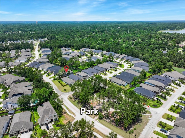 296 N Cascade Heights Dr, Montgomery, TX 77316 - aerial view of property and surrounding area featuring a forest and nearby suburban area