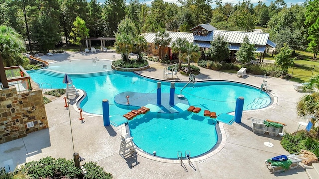 296 N Cascade Heights Dr, Montgomery, TX 77316 - community pool featuring a patio and view of wooded area