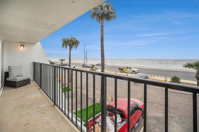 7310 Seawall Blvd Unit 210, Galveston, TX 77551 - balcony featuring view of water and beach
