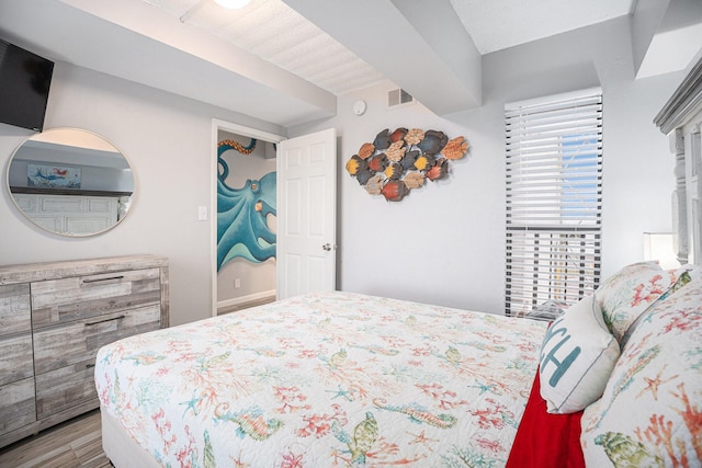 7310 Seawall Blvd Unit 210, Galveston, TX 77551 - bedroom with wood finished floors