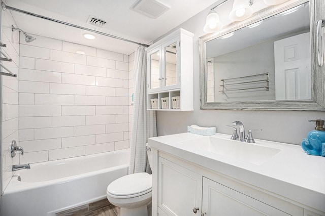 7310 Seawall Blvd Unit 210, Galveston, TX 77551 - bathroom featuring toilet, shower / bath combination with curtain, vanity, and wood finished floors
