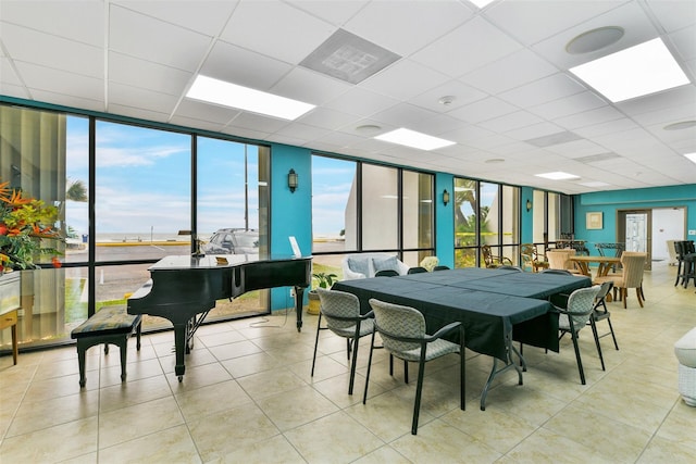 7310 Seawall Blvd Unit 210, Galveston, TX 77551 - tiled dining room with floor to ceiling windows and a paneled ceiling