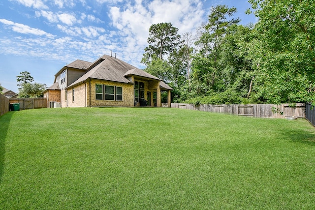 1704 Graystone Hills Dr, Conroe, TX 77304 - back of property featuring brick siding and cooling unit