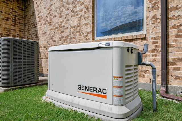 1704 Graystone Hills Dr, Conroe, TX 77304 - exterior view of a power unit, brick siding, and central AC unit