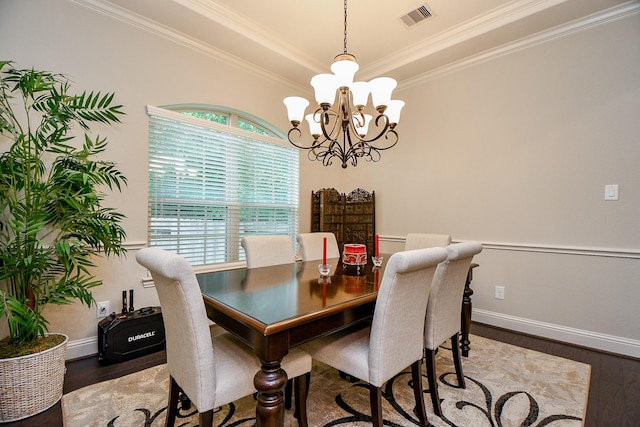 1704 Graystone Hills Dr, Conroe, TX 77304 - dining area with wood finished floors, a chandelier, ornamental molding, and healthy amount of natural light