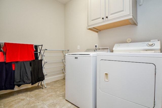 1704 Graystone Hills Dr, Conroe, TX 77304 - laundry room featuring washing machine and dryer and cabinet space