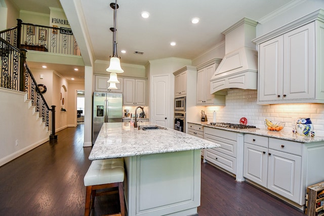 1704 Graystone Hills Dr, Conroe, TX 77304 - kitchen with a sink, stainless steel appliances, ornamental molding, tasteful backsplash, and a breakfast bar