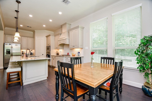 1704 Graystone Hills Dr, Conroe, TX 77304 - dining room featuring crown molding, dark wood finished floors, baseboards, and recessed lighting