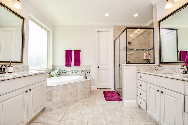 1704 Graystone Hills Dr, Conroe, TX 77304 - full bathroom featuring crown molding, a stall shower, two vanities, and a garden tub