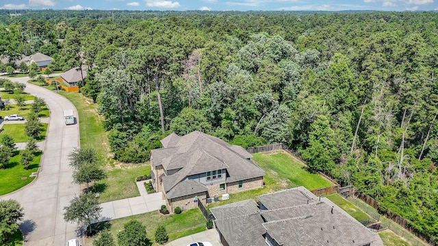 1704 Graystone Hills Dr, Conroe, TX 77304 - view of subject property with a forest