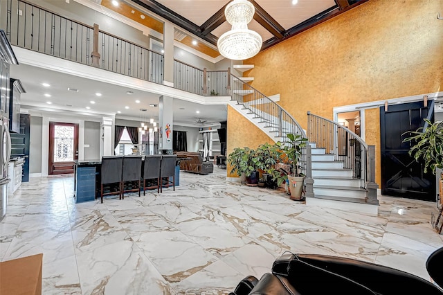 6121 County Road 225, Hungerford, TX 77448 - lobby with crown molding, stairs, coffered ceiling, a towering ceiling, and beam ceiling