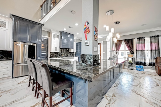 6121 County Road 225, Hungerford, TX 77448 - kitchen featuring smart refrigerator, crown molding, light marble finish floors, decorative backsplash, and a breakfast bar area