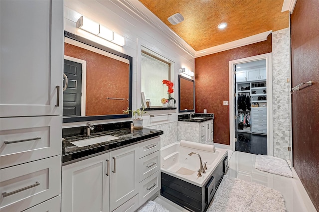 6121 County Road 225, Hungerford, TX 77448 - bathroom featuring crown molding, two vanities, a whirlpool tub, a spacious closet, and recessed lighting