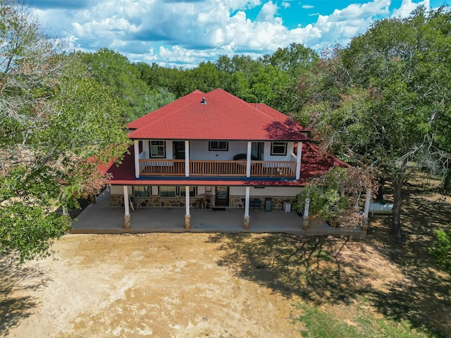 6121 County Road 225, Hungerford, TX 77448 - back of house with a patio area