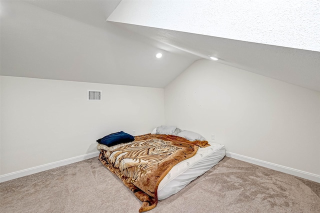 6121 County Road 225, Hungerford, TX 77448 - carpeted bedroom featuring lofted ceiling and baseboards