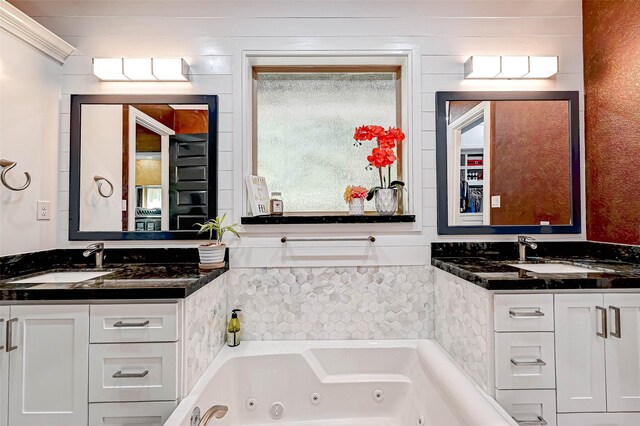 6121 County Road 225, Hungerford, TX 77448 - bathroom featuring vanity and a jetted tub