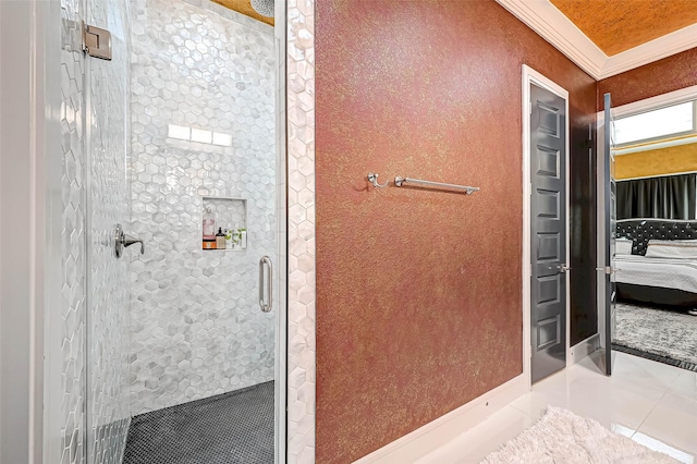 6121 County Road 225, Hungerford, TX 77448 - ensuite bathroom featuring a shower stall, ornamental molding, tile patterned floors, and baseboards