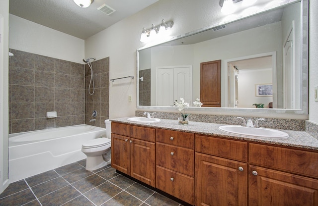 1711 Old Spanish Trl Unit 401, Houston, TX 77054 - bathroom with double vanity, shower / bath combination, tile patterned floors, and toilet