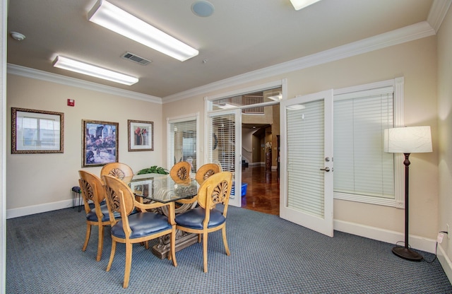 1711 Old Spanish Trl Unit 401, Houston, TX 77054 - dining space with crown molding, dark carpet, baseboards, and french doors