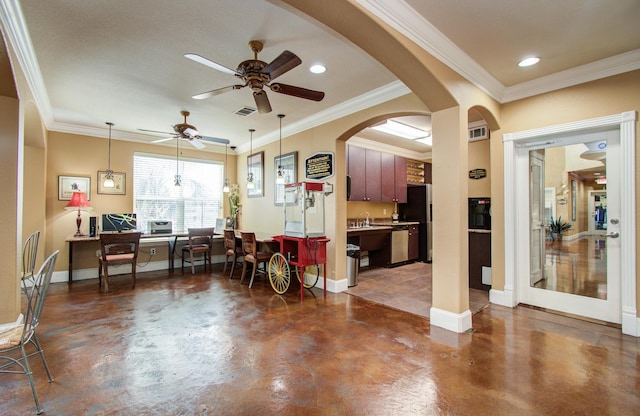 1711 Old Spanish Trl Unit 401, Houston, TX 77054 - living area featuring concrete floors, baseboards, ceiling fan, arched walkways, and crown molding