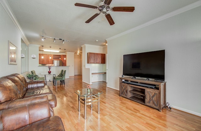 1711 Old Spanish Trl Unit 401, Houston, TX 77054 - living area featuring crown molding, a ceiling fan, light wood-style floors, and baseboards
