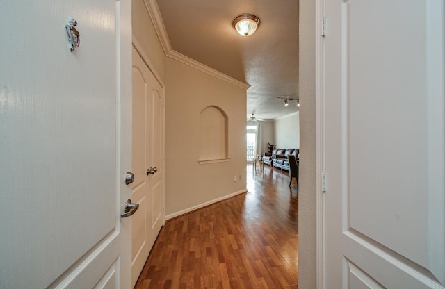 1711 Old Spanish Trl Unit 401, Houston, TX 77054 - hallway featuring crown molding and wood finished floors