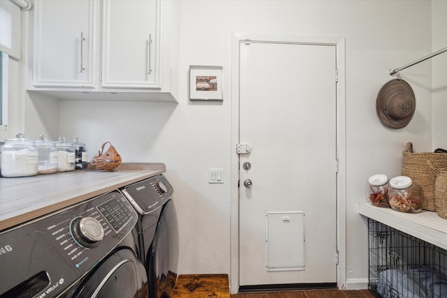 2227 Holly Knoll St, Houston, TX 77077 - washroom featuring cabinet space, washing machine and clothes dryer, dark wood-type flooring, and a fireplace