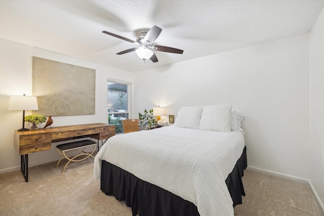 2227 Holly Knoll St, Houston, TX 77077 - bedroom with light carpet, baseboards, and a ceiling fan