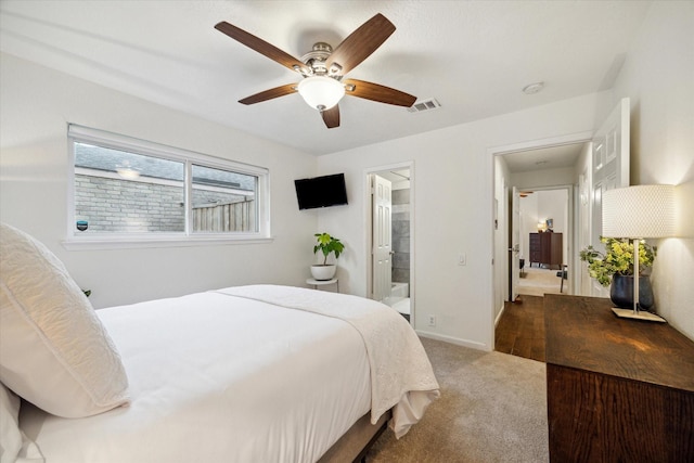 2227 Holly Knoll St, Houston, TX 77077 - carpeted bedroom with ensuite bathroom, baseboards, and a ceiling fan