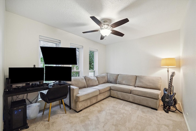 2227 Holly Knoll St, Houston, TX 77077 - living area with a ceiling fan, carpet flooring, a textured ceiling, and baseboards