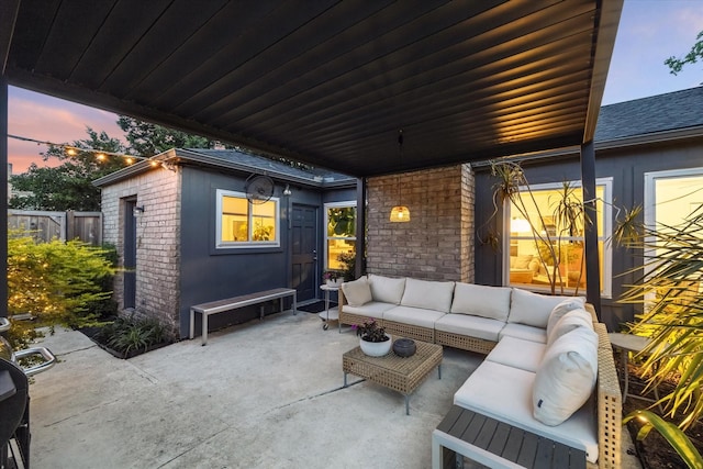 2227 Holly Knoll St, Houston, TX 77077 - patio terrace at dusk with a patio area and an outdoor living space