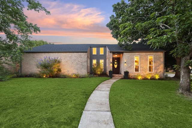 2227 Holly Knoll St, Houston, TX 77077 - mid-century home with brick siding, a yard, and roof with shingles